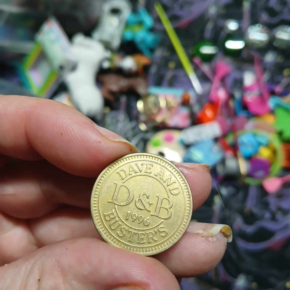 vintage 1996 Dave & Buster's D&B arcade game token. Brass